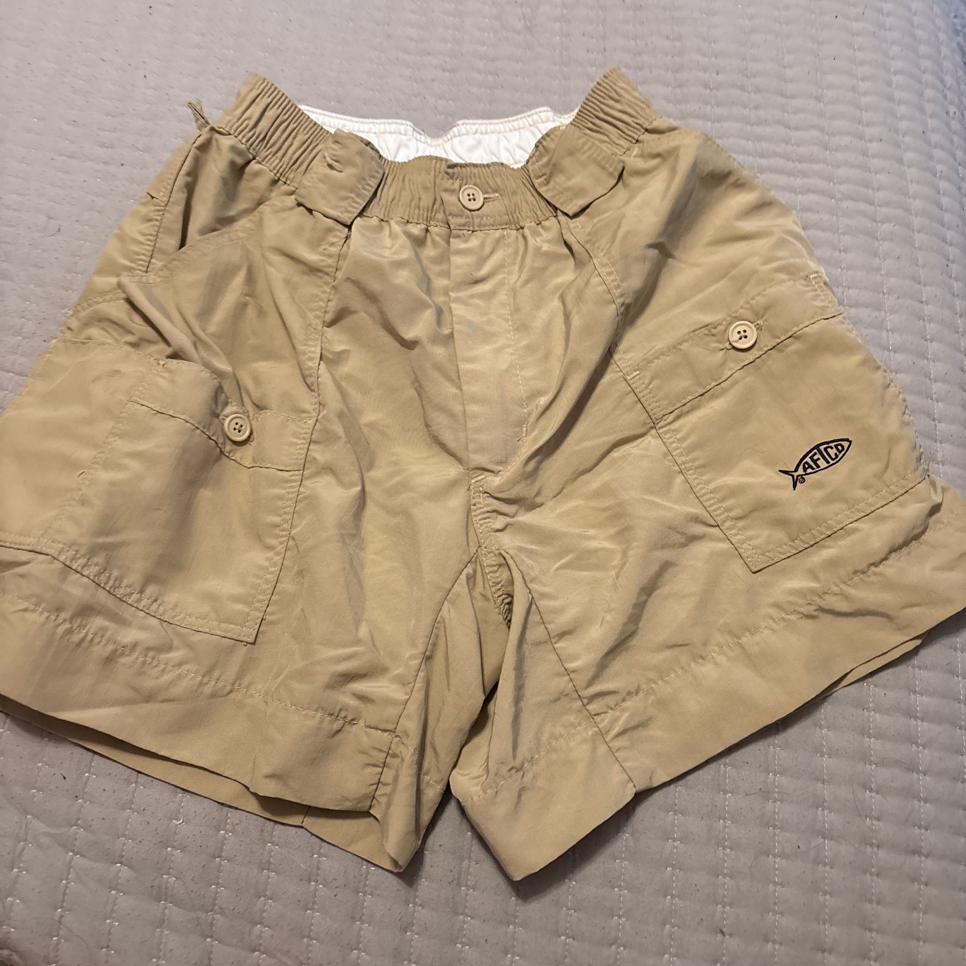 tan swim trunks