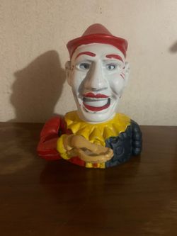 Vintage cast iron mechanical coin bank, commonly known as the Humpty Dumpty or Clown/Jester bank
