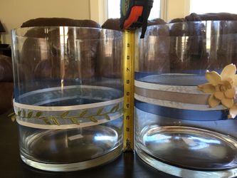 2 large clear glass cylinders