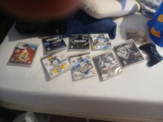 PLAYSTATION 3 GAMES AND WIRELESS CONTROLLER