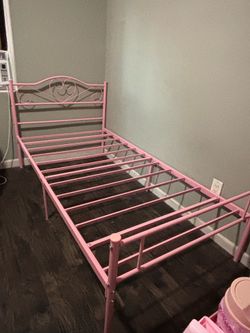 Pink size twin bed with mattress included
