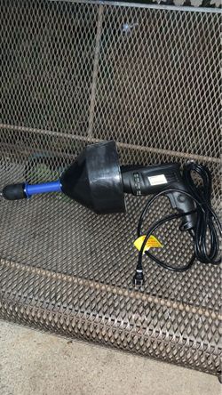 Hand held drain cleaning machine