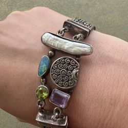 Unique vintage sterling silver 925 bracelet chain mother of pearl, amethyst, peridot, opal, turquoise  Marked 925 Stunning well made piece  Approx 8 1
