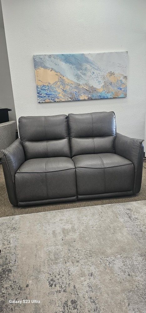 Leather Loveseat With 2 Power Recliners.
