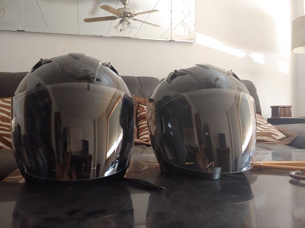 Two new Harley Davidson helmets with cloth cases