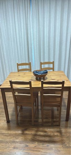 Ikea wooden table and four chairs