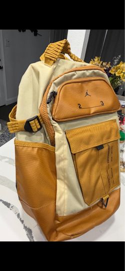 Nike 23 Engineered mustard tan backpack.