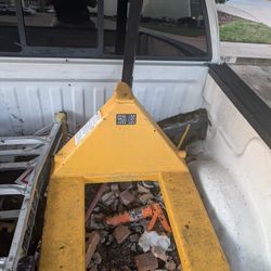 

The item in the image is an Apollo manual pallet jack with a 5,500 lbs capacity. 