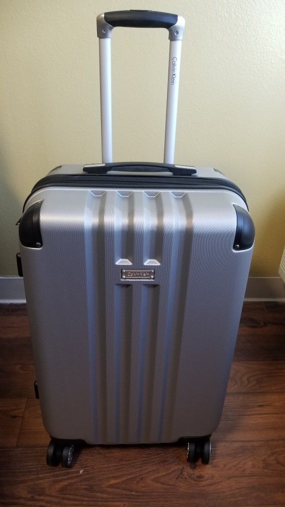 Calvin Klien & Bebe mid size hard shell luggage