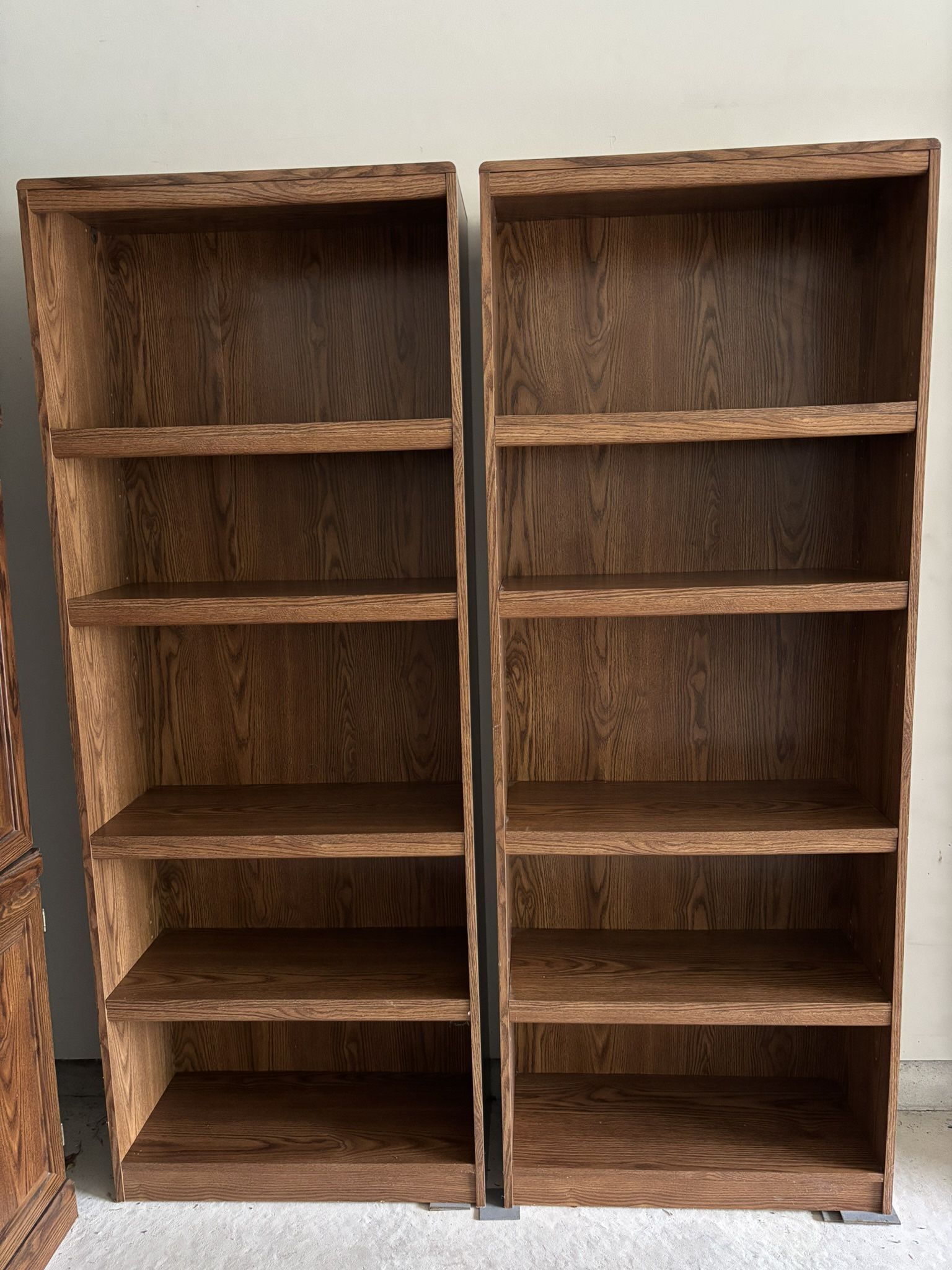 Bookcases Heavy Engineered Wood With Oak Finish, set of 2, good condition, 6 total shelves each including 3 adjustable, 72”H X 28”W X 12”D.