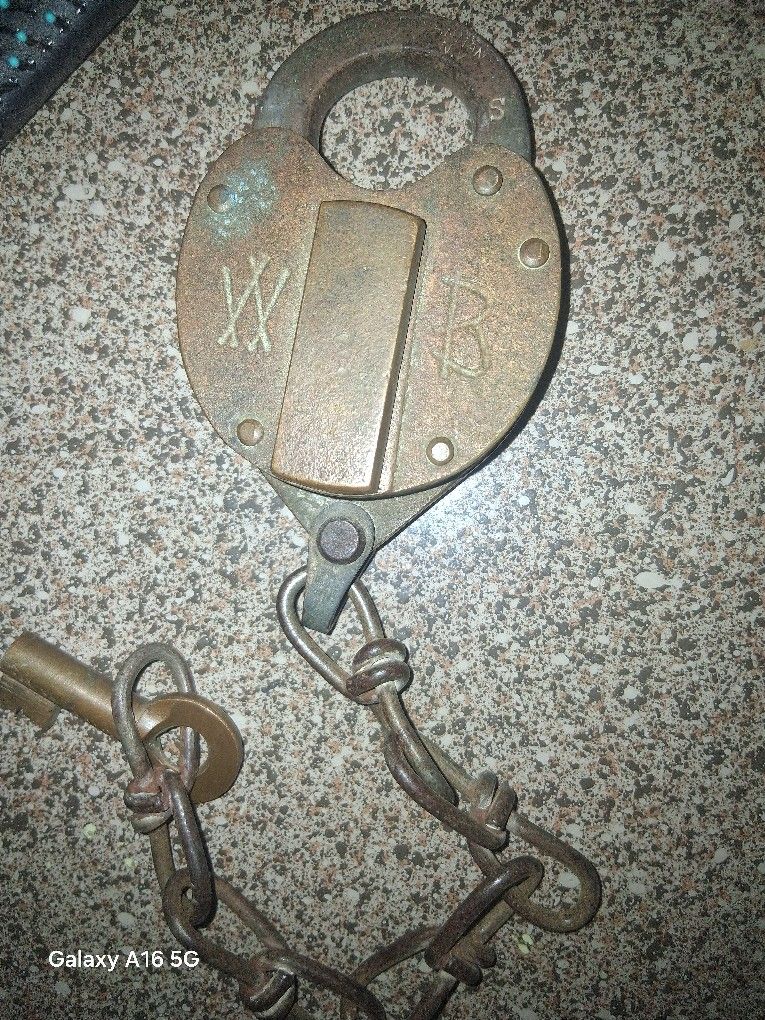 Old brass lock and two old wheat pennies