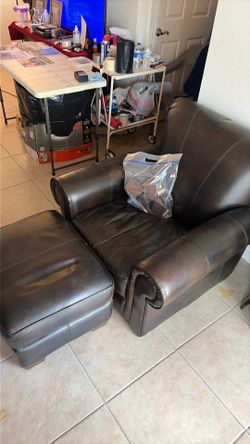 Leather easy chair with hassock