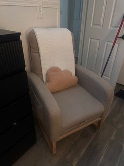 Light brown nursery rocking chair