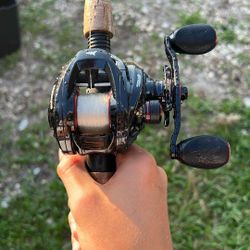 Kastking bait caster reel with a cherrywood berkley 7ft medium heavy rod