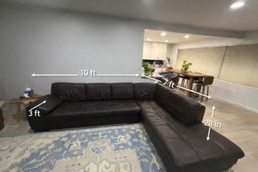 Large leather sectional couch with ottoman
