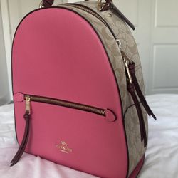 pink and beige Coach backpack