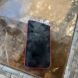 iphone 12 /Still turns on /a little broke in tge back