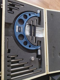 Micrometer and dial indicator.