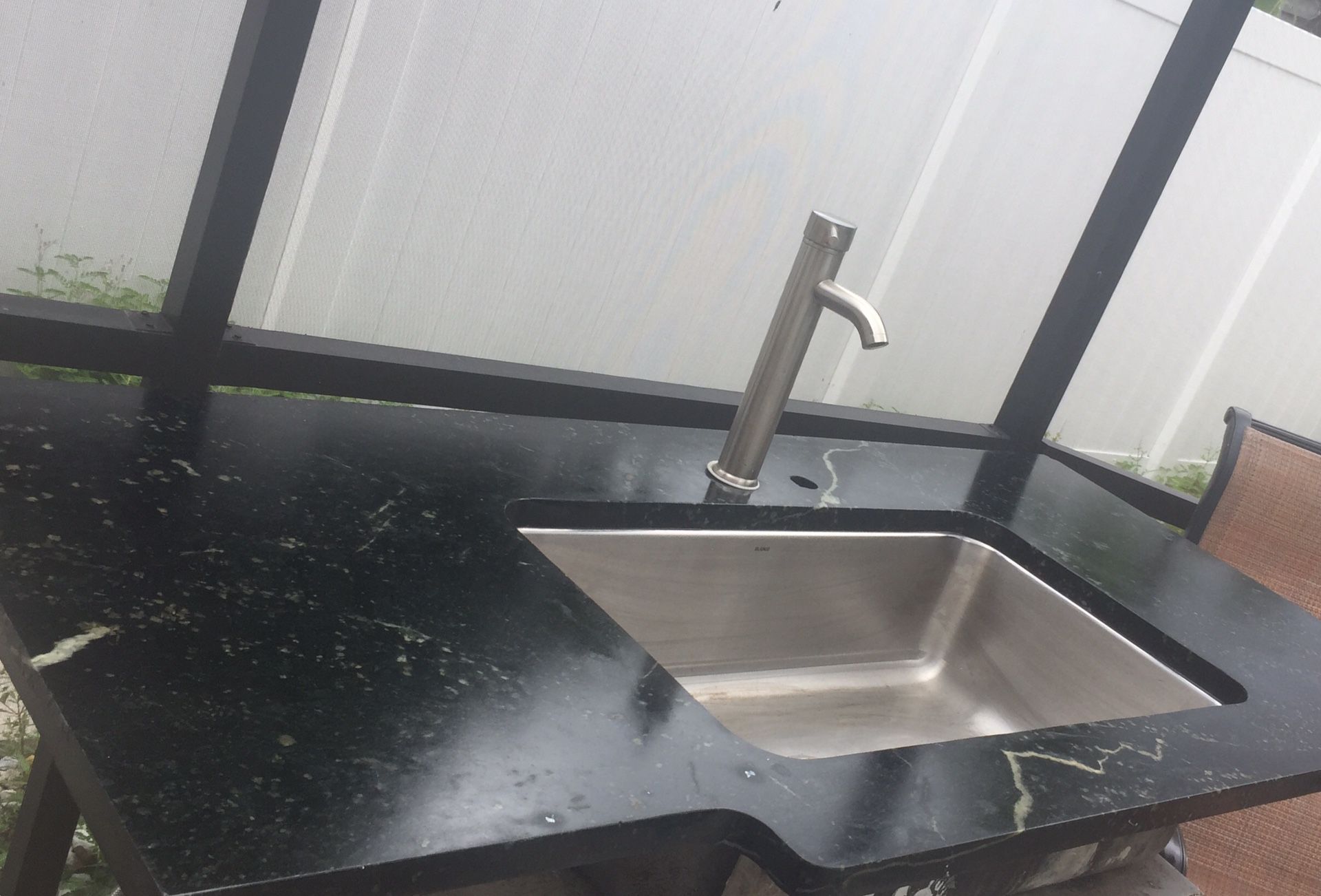 Granite counter top with modern Kitchen Sink / outdoor kitchen