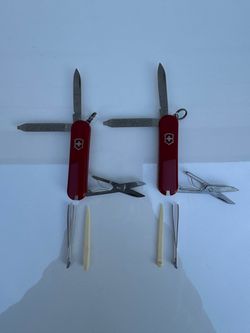 Two brand-new Victorinox Signature 58mm Swiss Army Knives