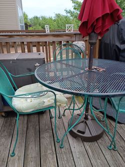 Wrought iron table with 3 chairs