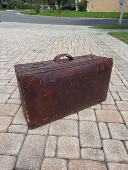 Vintage leather suitcase with dragon embossing