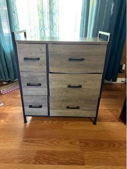 Modern five drawer storage dresser with wood top and front drawer wood panels