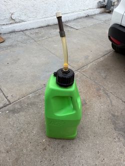 Green LC2 plastic utility jug with black screw-on cap and built-in surface wear visible.( looks like brand new )