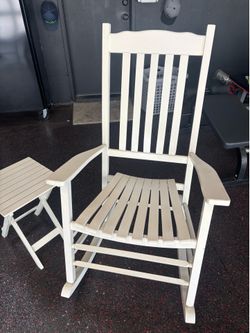 White wooden rocking chair with side table
