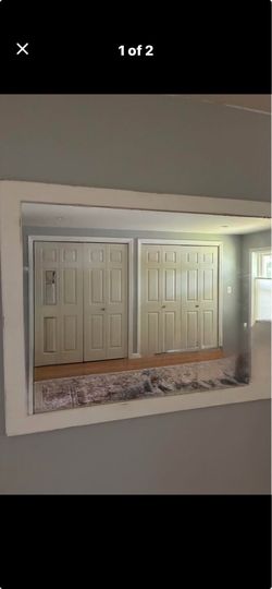 Large wall mirror with white frame