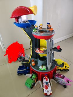 Paw Patrol toy set. HUGE lot of paw patrol figures and trucks WITH tower house.