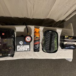 Auto cleaning kit and weather resistant rain suit.