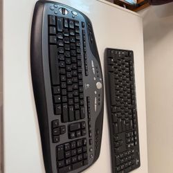 Two Logitech Cordless Keyboards