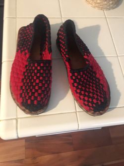 Shows made of fabric and leather and plastic sole.