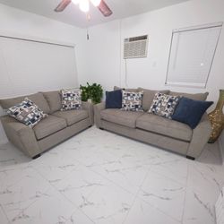Light gray with decorated pillows.