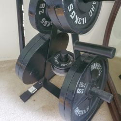 4 each 45Ib Barbell plates 
