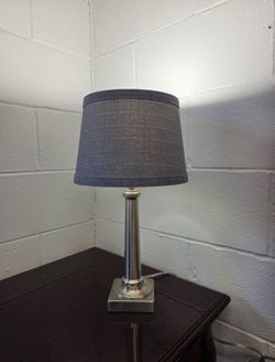 18” modern table lamp with brushed metal column and gray textured shade