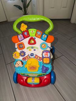 V-Tech Baby sit and stand interactive walker