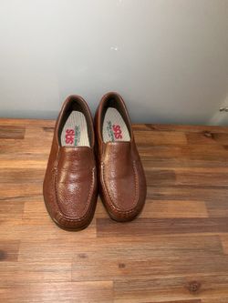 These are brown SAS Twin moccasin-style shoes with a textured leather design.