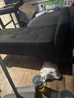 Sofa storage for pillows and covers her clothes