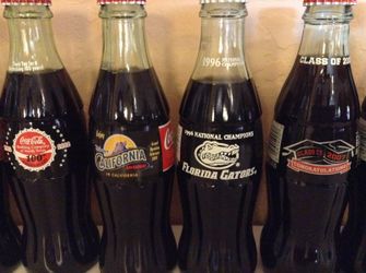 Dozens of different Coca-Cola bottles for sale. Coke