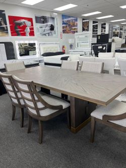 Modern Design dining set features brown & gold finish w/trestle base