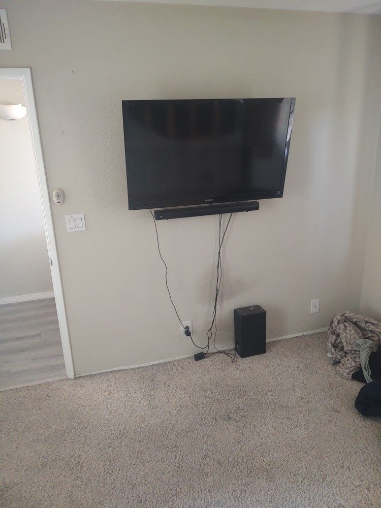 46in. Sony TV with Sound Bar/ Sub and Wall Mount