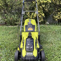 NEW RYOBI 13 " INCH 11AMP CORDED LAWNMOWER COMES IN A BOX. IT'S VERY CUTE LITTLE LAWNMOWER PERFECT FOR THE SMALL FRONT OR BACK YARD. IT DOES REQUIRE E