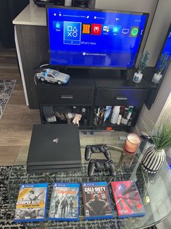 PS4 with 2 controllers and 4 games