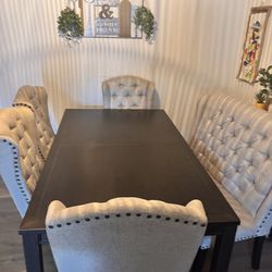 Negotiable Almost new dining table with 4 chairs and bench