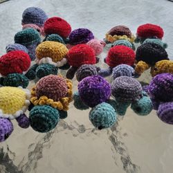 crocheted turtle made with velvet yarn.  can make sunflower and daisy turtle shells.  Very soft. 4" x 6".
