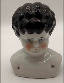 Antique German porcelain China, doll head, low brow, black hair, manufactured between 1(contact info removed)