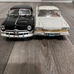 Diecast 1/18 Scale  1957 Plymouth fury and 1950 Ford Convertible top  Black both cars for 40 dollars 