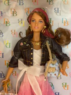 Mattel Vintage Katiana Jimenez Designed Dooney & Bourke Barbie was released in 2006 as part of the Pink Label Collector series. In-box, new-condition